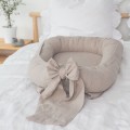 linen baby nest with bow