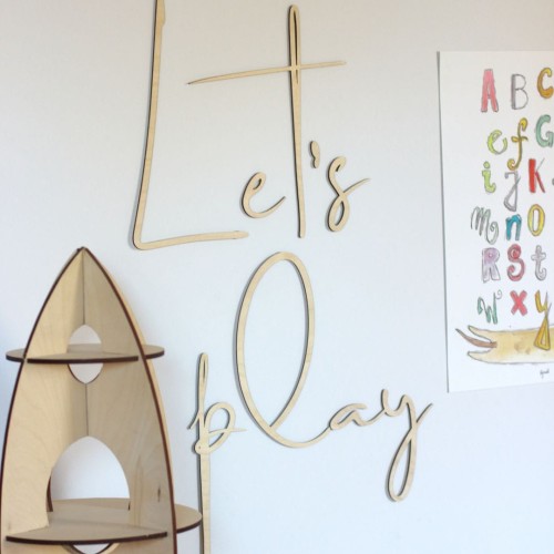Wooden inscription on the wall for a child's room