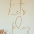Wooden inscription on the wall for a child's room