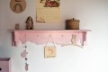 pink shelf with hangers for kids room